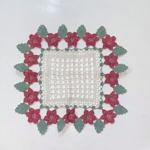Crochet Floral Doily with Pink and Green Accents